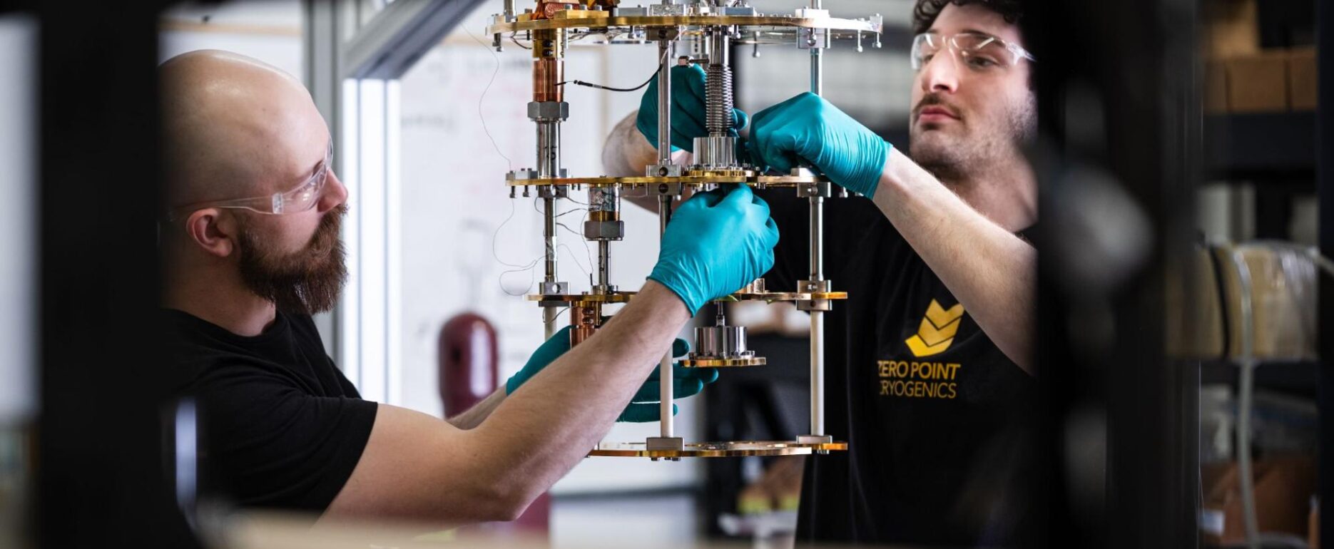 Zero Point Cryogenics team member assembling a cryogenic system inside the facility.