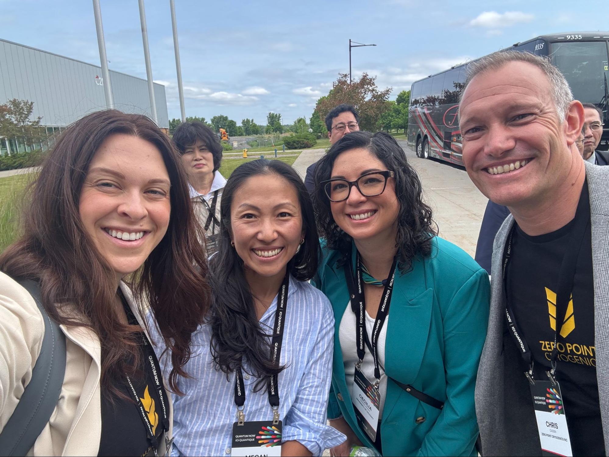 Group selfie featuring Zero Point Cryogenics team members and fellow Quantum Now 2025 attendees smiling outdoors during a networking or excursion moment.